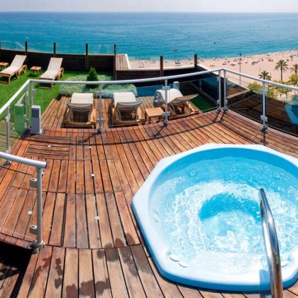 Discover Calella with half board and spa in a beachfront hotel