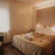 Romantic room with bath salts, soap bomb, petals, chocolates, champagne and detail