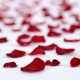 Romantic room with bath salts, soap bomb, petals, chocolates, champagne and detail