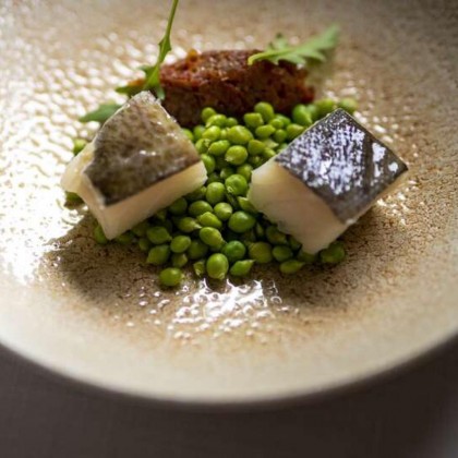 Romantic getaway in idyllic surroundings with glass of cava and chocolates