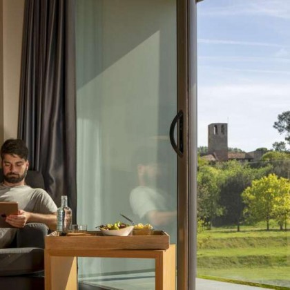 Romantic getaway in idyllic surroundings with glass of cava and chocolates